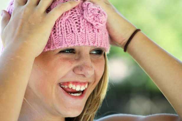 woman wearing pink knit cap